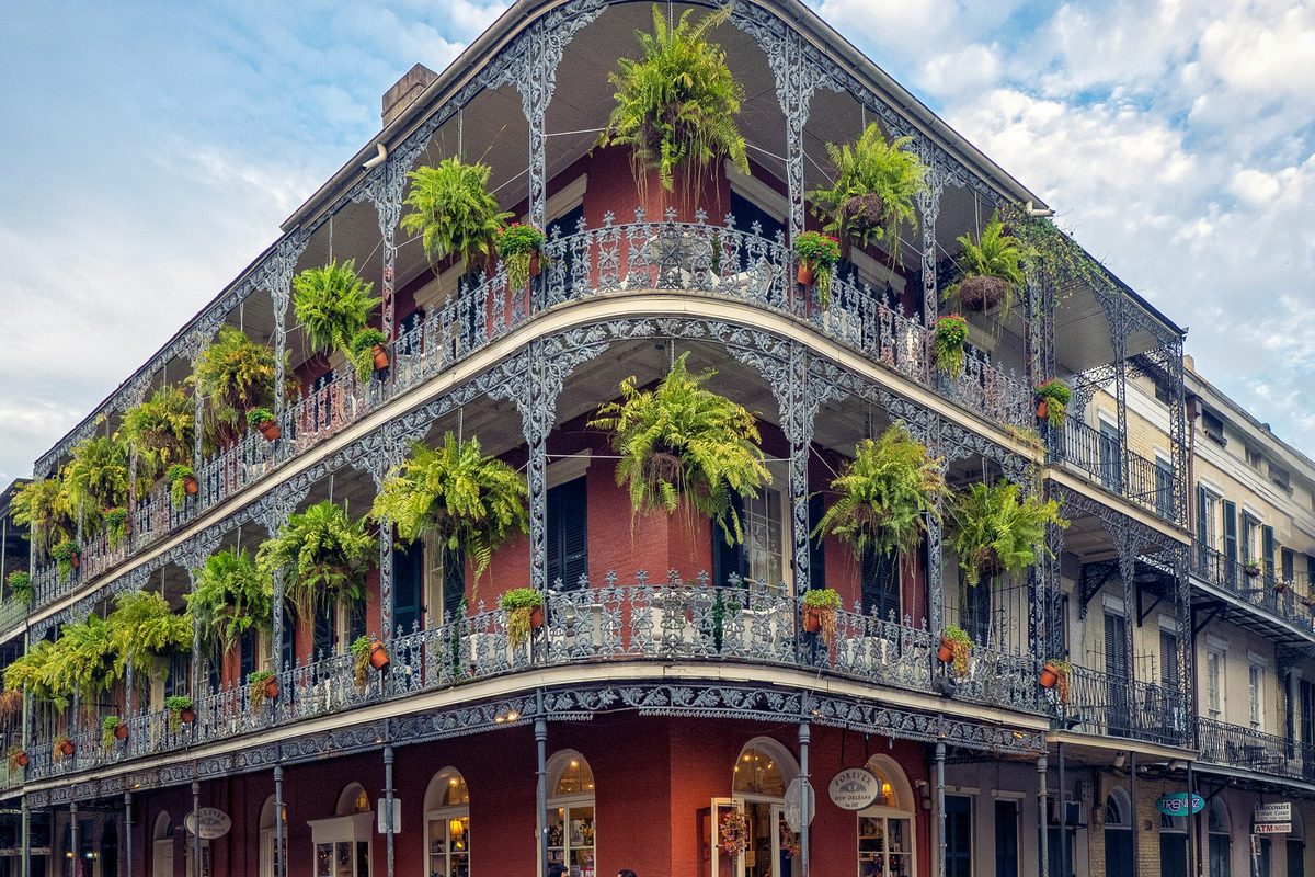 Wrought-iron balconies hung with ferns in the French Quarter, New Orleans